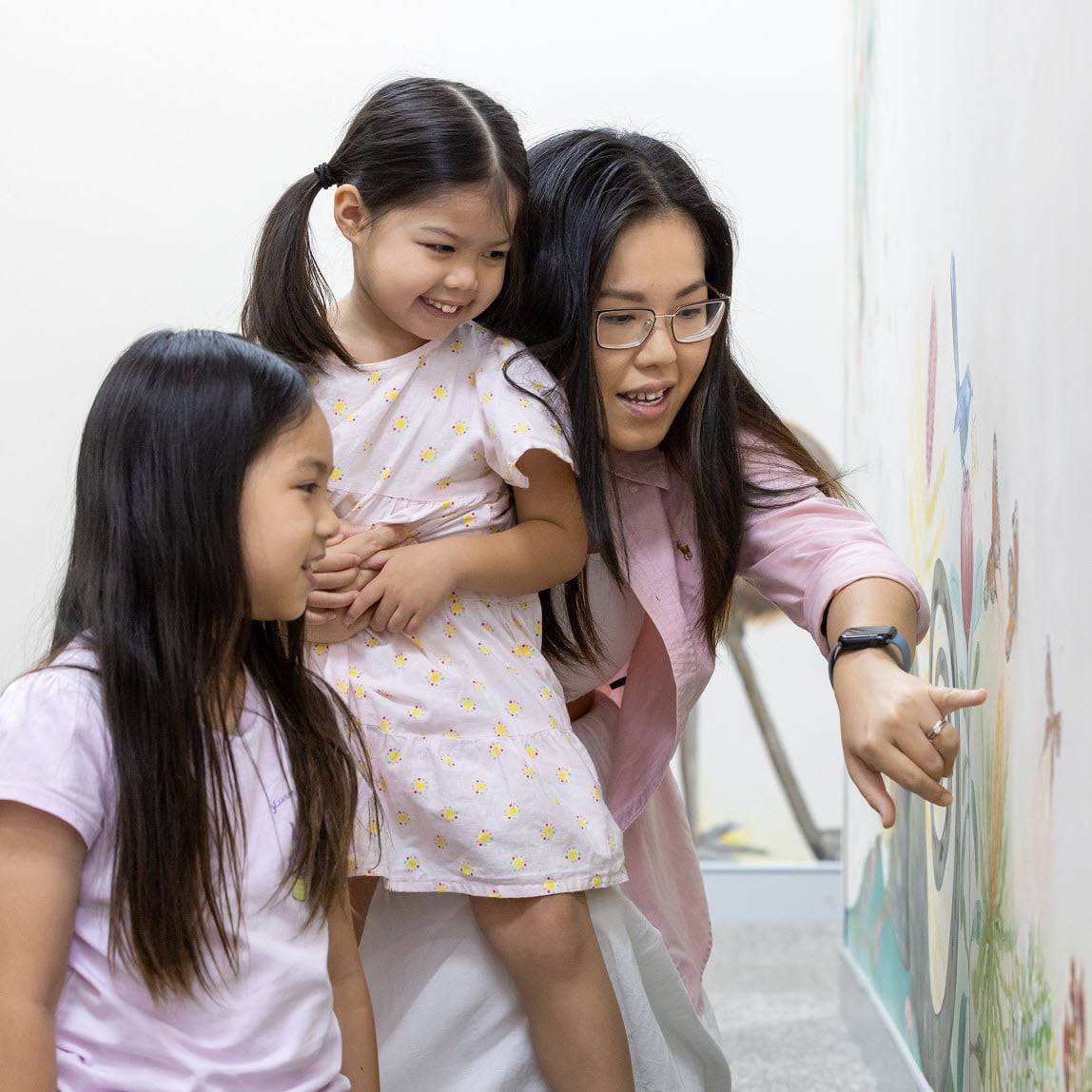 Happy mother and two daughters satisfied with the mental health services provided by Holyoake in Western Australia.