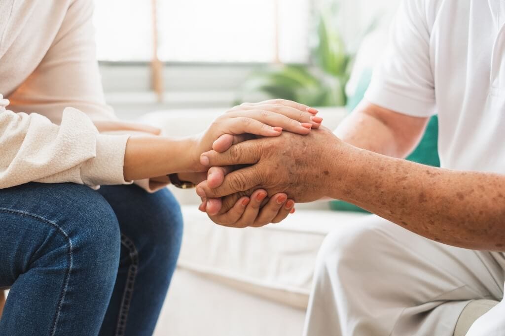 Counsellor consoling patient who had been struggling with relapse
